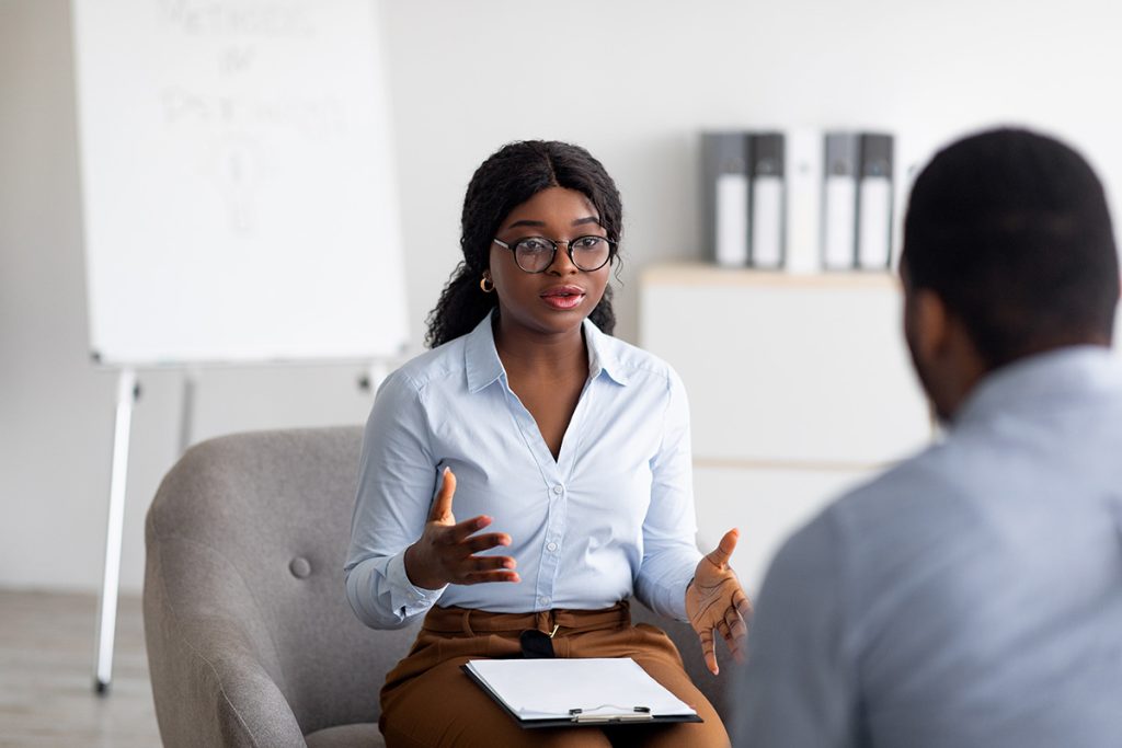 Mental health therapist speaking with a client during an individual counseling session.